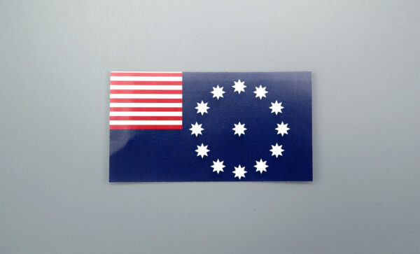 Photo of a sticker of the Easton PA flag, roughly 2.75 by 1.5 inches.
