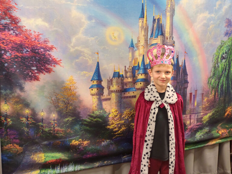 The young birthday king wears his crown during a party at the Sigal Museum.