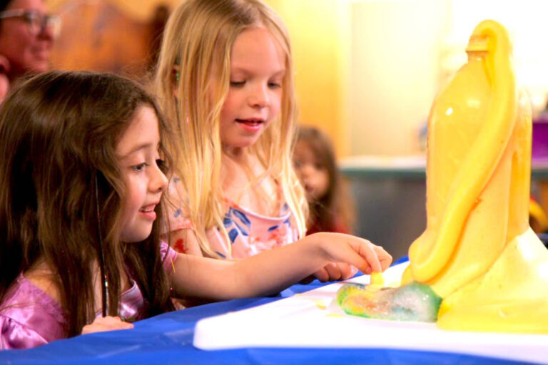 Young museumgoers enjoy a science demonstration during an event at the Sigal Museum.